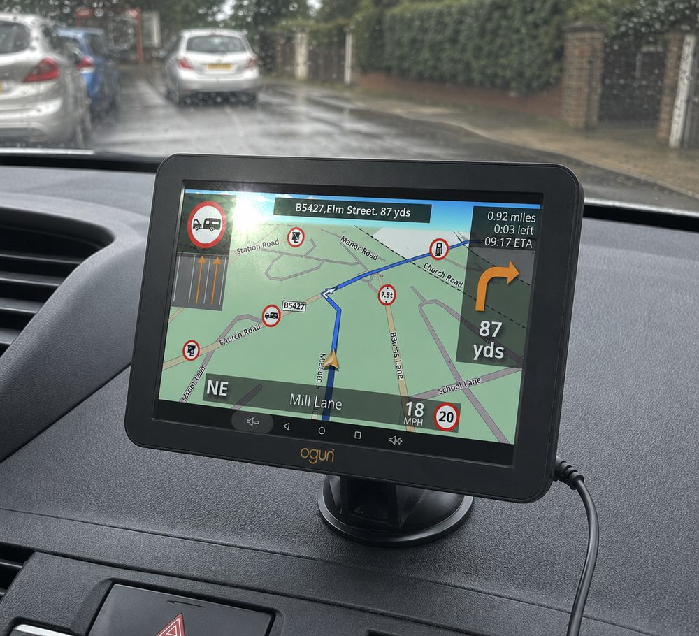Aguri RV760 mounted in a cab, guiding to the next turn with restriction icons on the map